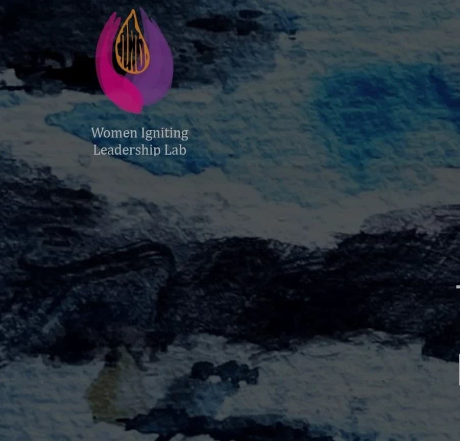 Logo of Women Igniting Leadership Lab - a stylized flower with pink and purple petals over ocean waves
