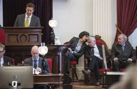 Side conversation with Senator Westman in a Joint Session of the General Assembly.