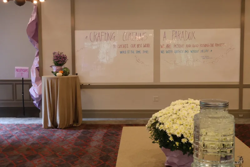 Program whiteboards and flowers styled by Saffron Samuels