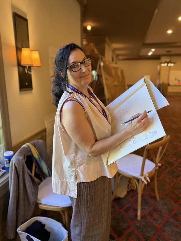 Saffron Samuels sketching during the program
