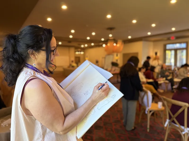 Saffron Samuels sketching during the program